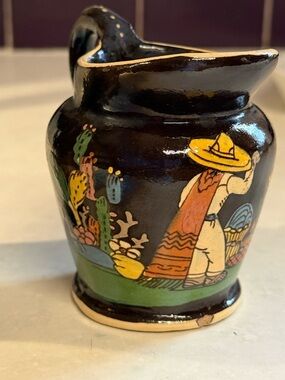 vintage hand-painted Mexican terracotta cup or vase and small pitcher.
